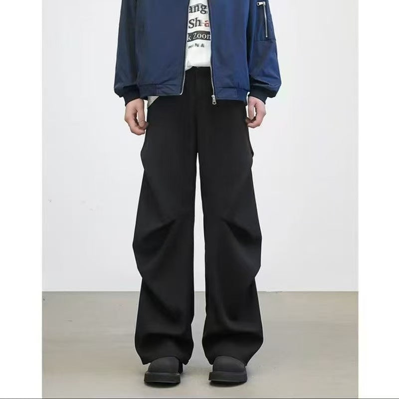 Diamond-cut pleated trousers